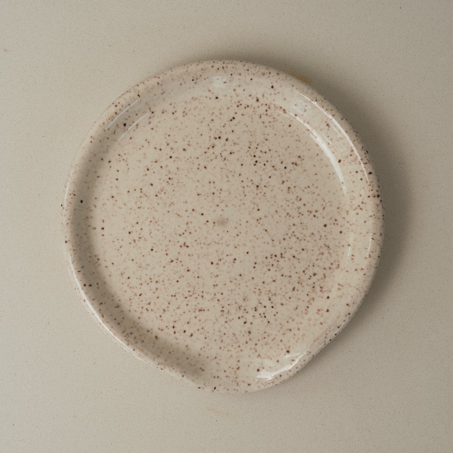 Speckled ceramic spoon rest